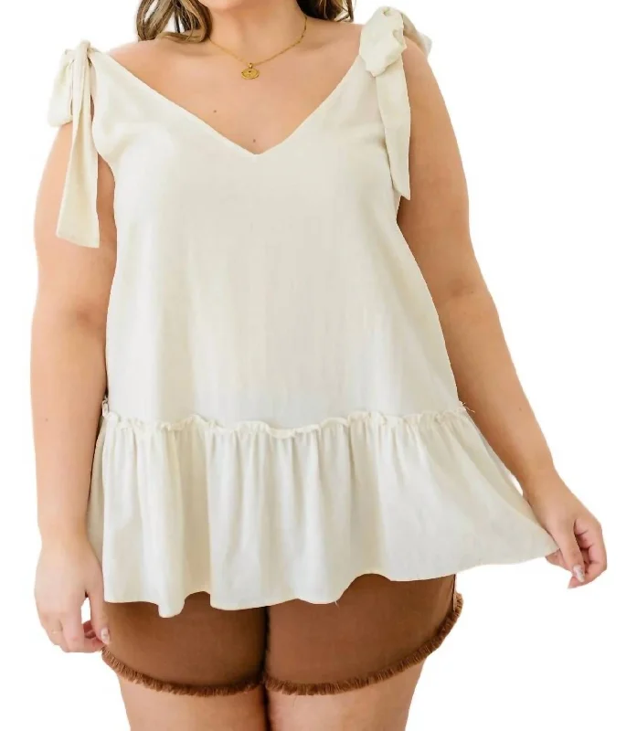 All Tied Up Peplum Tank In Ivory